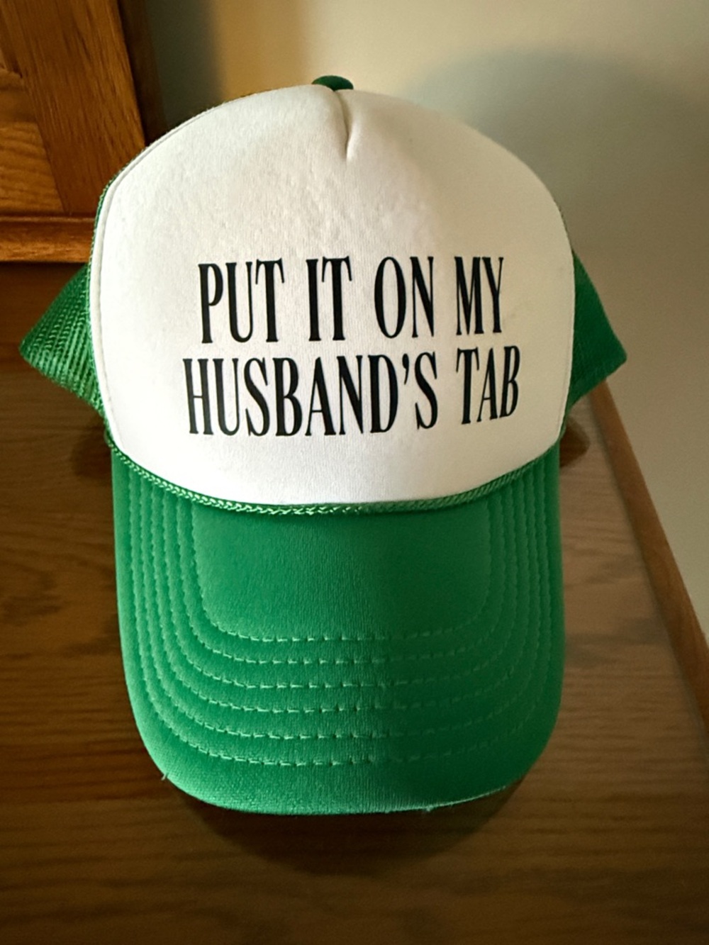 Green and White Trucker Hat with 'Put It On My Husband's Tab'